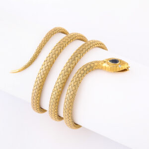 American 14kt Gold Woven Flexible Bracelet with Diamond Eyes and Sapphire