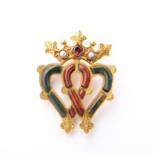 Victorian Period Antique Scottish Varicolored Chalcedony 15kt Gold Luckenbooth Brooch set with a Garnet and Half-Pearls