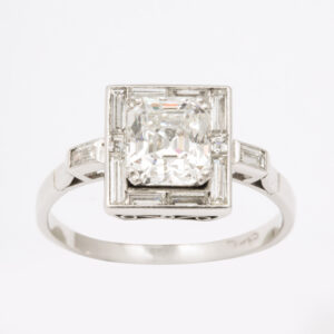 American Diamond bordered with Baguette Cut Diamonds Ring mounted in Platinum